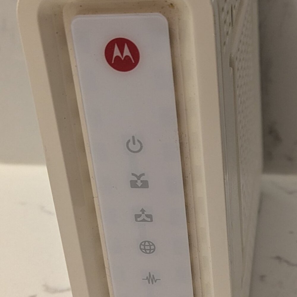 Arris Surfboard SB6141 Cable Modem with charging cord white